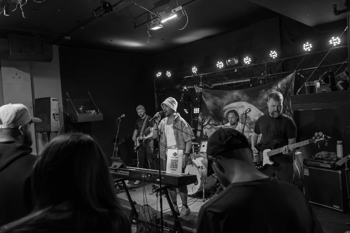 Black and white wide shot of the crowd watching NotMuch at The Wolf